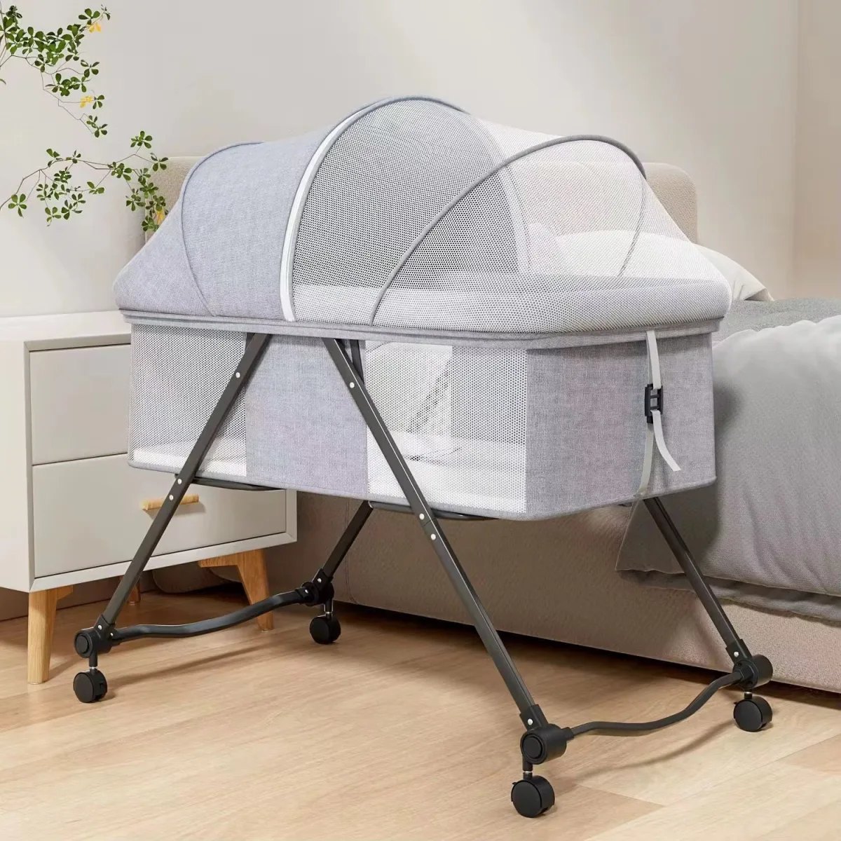 Foldable four wheel badside cradle bed